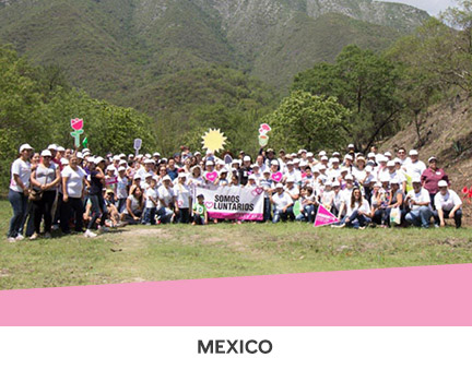 Mary Kay employees and their families planting hundreds of trees in Mexico on Planting Day.